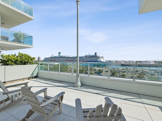 view of patio featuring a balcony