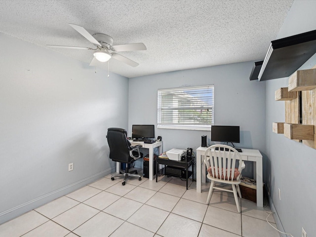 office area featuring a textured ceiling, light tile patterned floors, and ceiling fan