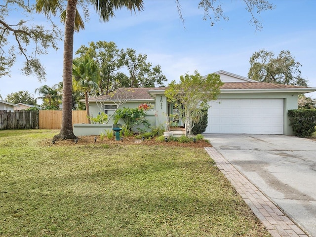 ranch-style home with a garage and a front yard