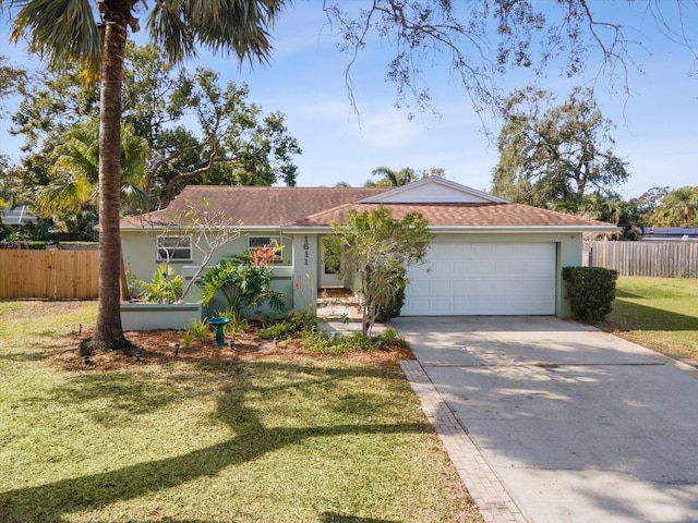 single story home with a garage and a front lawn