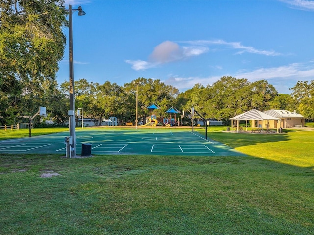 view of community featuring a lawn, a gazebo, basketball court, and a playground