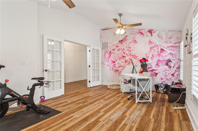 interior space featuring hardwood / wood-style floors, ceiling fan, lofted ceiling, and french doors