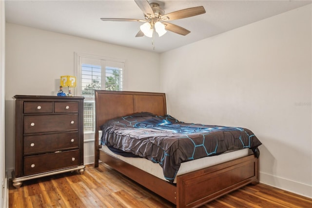 bedroom with hardwood / wood-style floors and ceiling fan