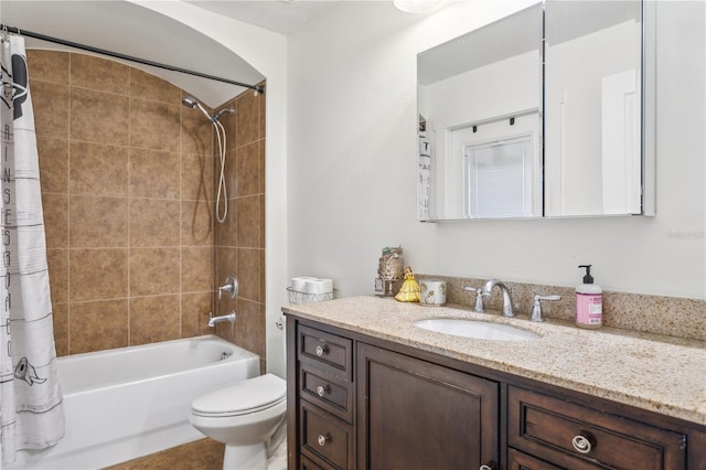 full bathroom featuring vanity, shower / bath combo, and toilet