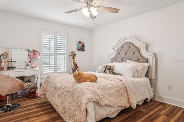 bedroom with dark hardwood / wood-style floors and ceiling fan