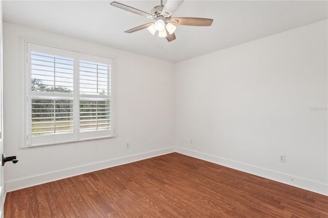 spare room featuring wood-type flooring and ceiling fan