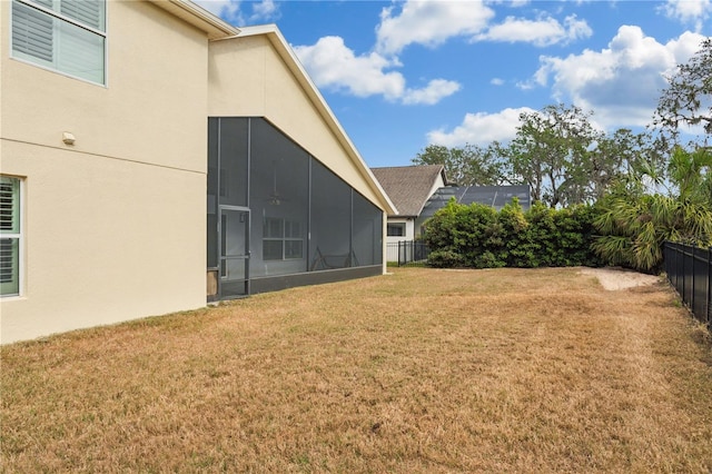 view of yard with a sunroom