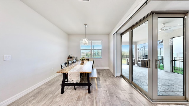 dining space with ceiling fan and light hardwood / wood-style floors