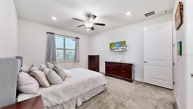 bedroom featuring ceiling fan and light carpet