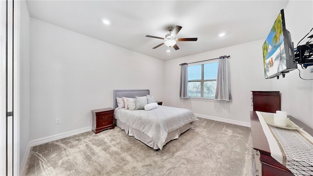 bedroom with light carpet and ceiling fan