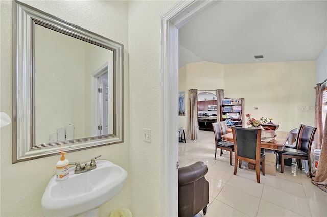 bathroom with tile patterned floors and sink