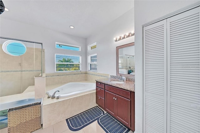 bathroom featuring vanity, tile patterned floors, and independent shower and bath