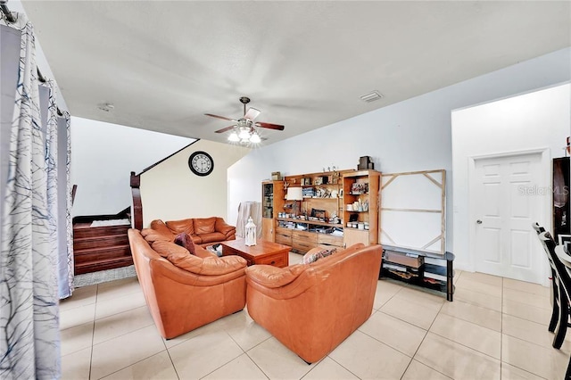 tiled living room featuring ceiling fan