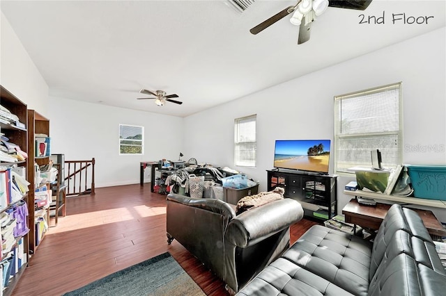 living room with ceiling fan and dark hardwood / wood-style floors