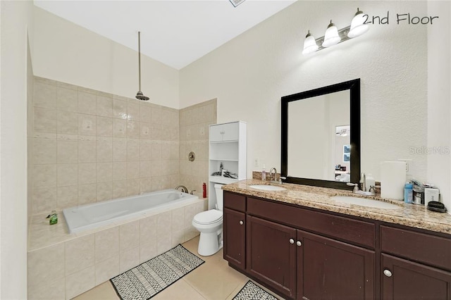 bathroom featuring tile patterned flooring, vanity, and toilet