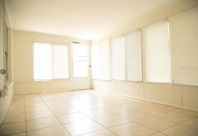 unfurnished room featuring light tile patterned floors