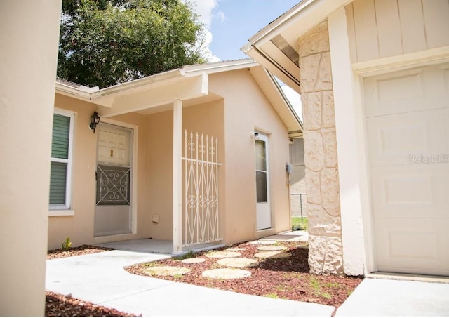 property entrance with a garage