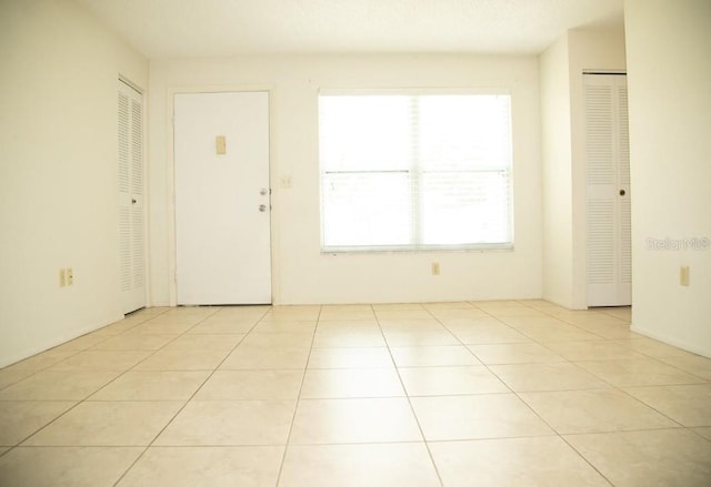 foyer entrance featuring light tile patterned floors