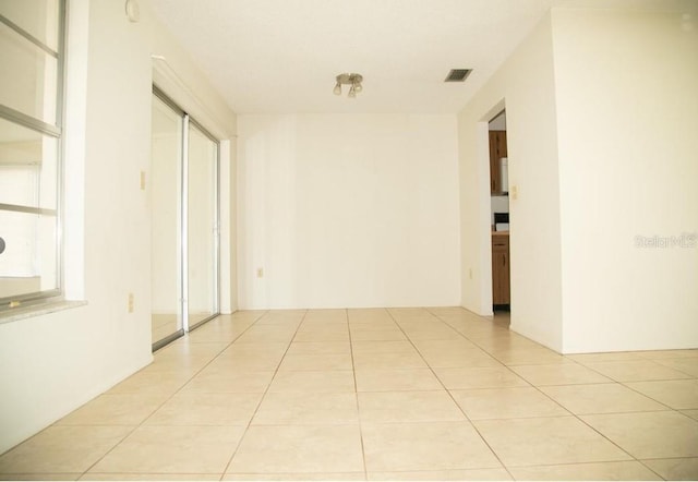 corridor with light tile patterned floors