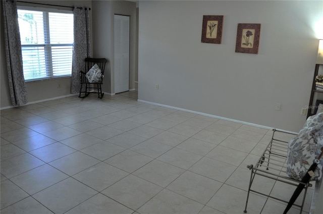 unfurnished living room with light tile patterned flooring