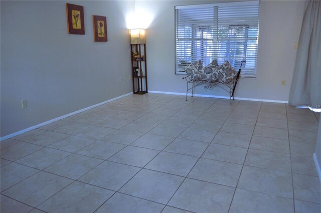 unfurnished room with light tile patterned floors