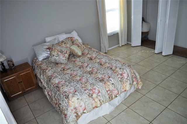 bedroom with light tile patterned floors