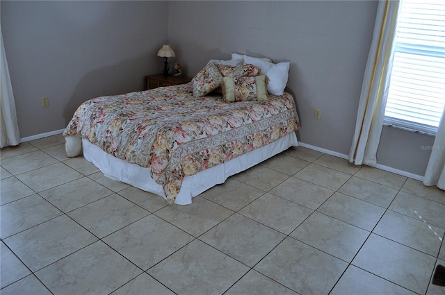 unfurnished bedroom featuring light tile patterned flooring