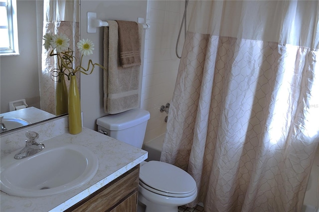 full bathroom with vanity, shower / bath combo, and toilet