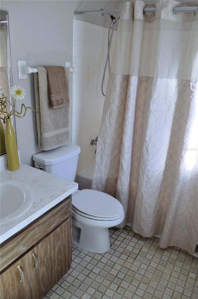 full bathroom with vanity, shower / bathtub combination with curtain, and toilet