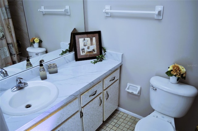 bathroom with walk in shower, vanity, and toilet