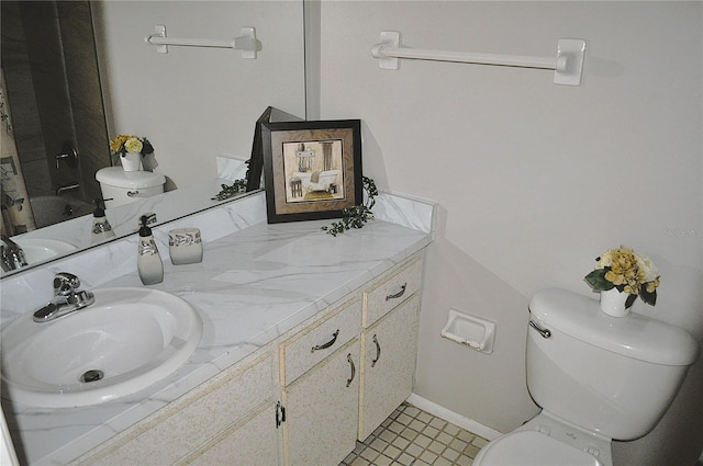 bathroom with walk in shower, vanity, and toilet