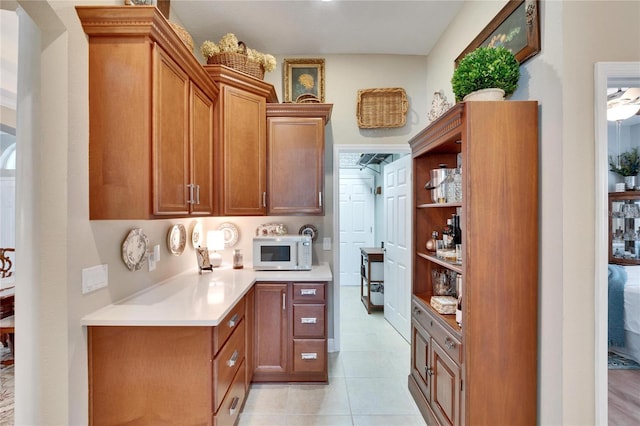 kitchen with light tile patterned floors