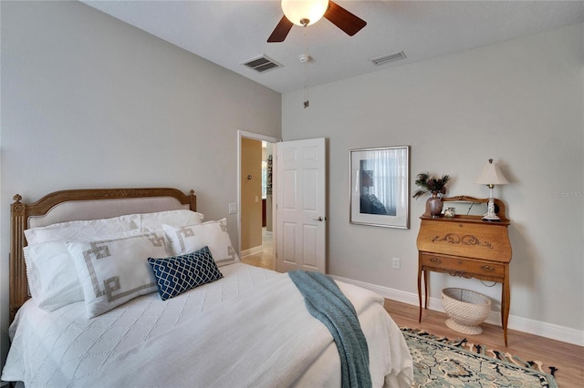 bedroom with ceiling fan and light wood-type flooring