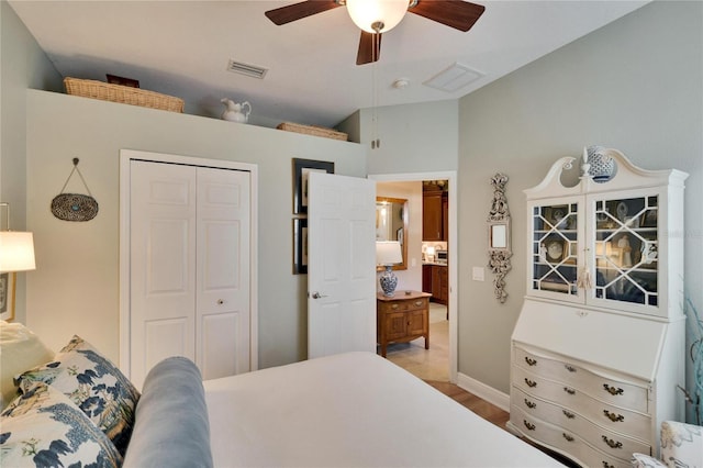 bedroom featuring ceiling fan, light hardwood / wood-style floors, and a closet