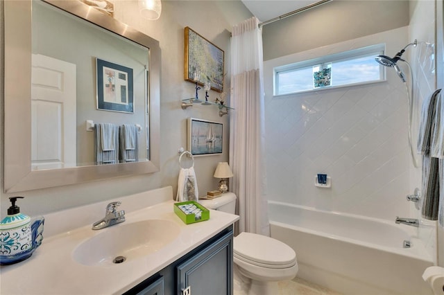 full bathroom with vanity, shower / tub combo, and toilet