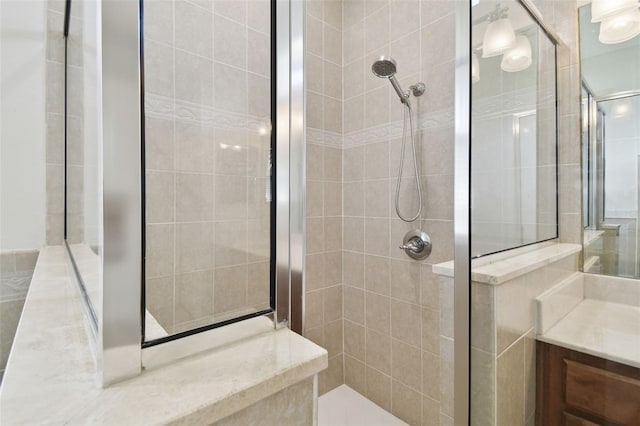 bathroom featuring vanity and walk in shower