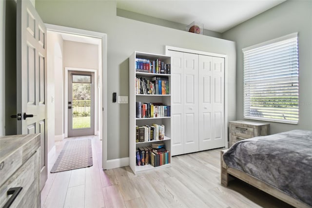 bedroom featuring a closet and light hardwood / wood-style flooring