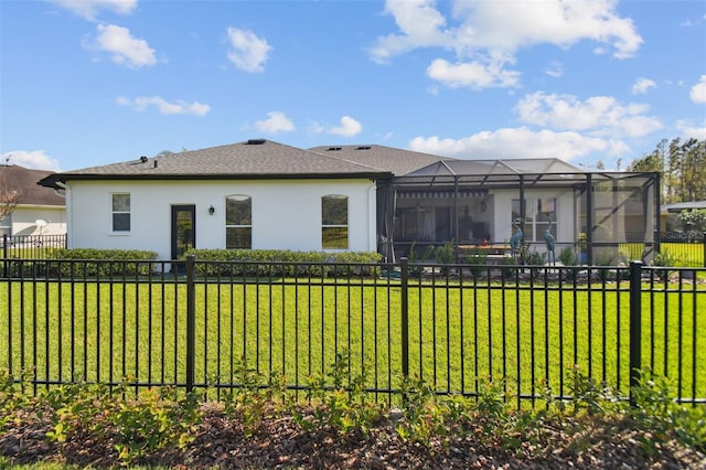 view of front of property with a front lawn and a lanai