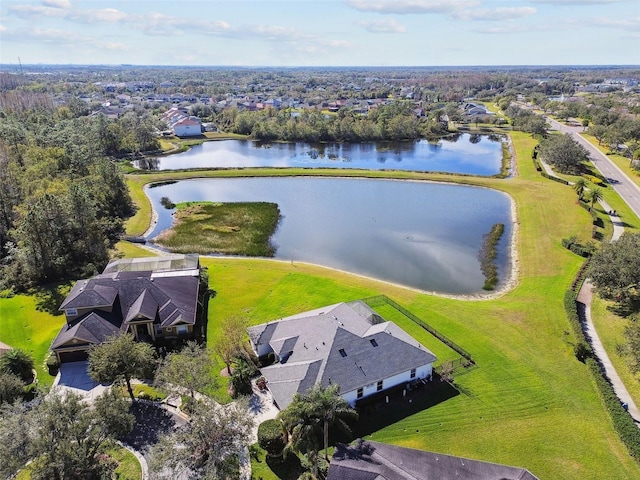 birds eye view of property with a water view