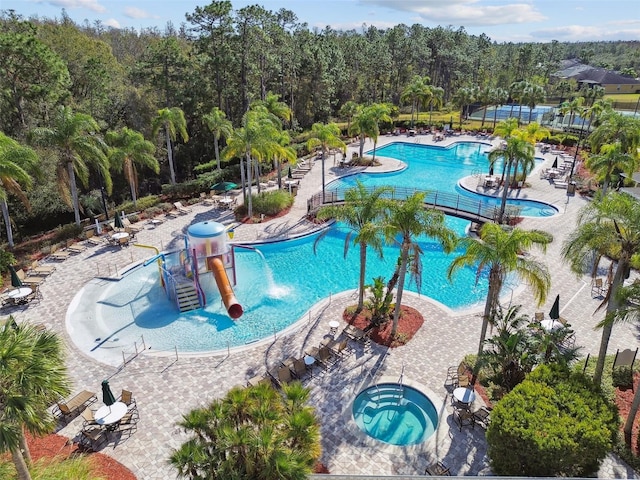 view of pool featuring a community hot tub