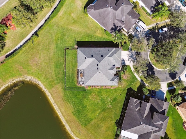 birds eye view of property featuring a water view