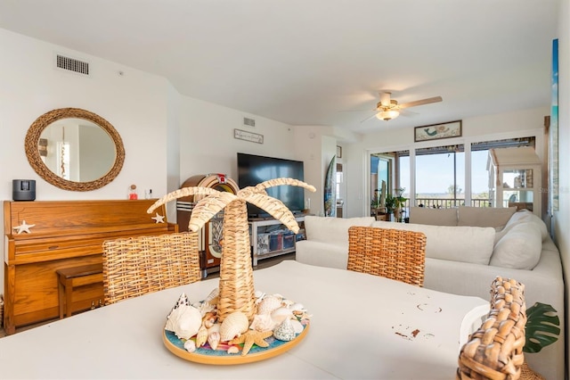 dining space with ceiling fan