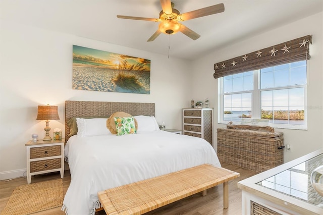 bedroom with hardwood / wood-style flooring and ceiling fan