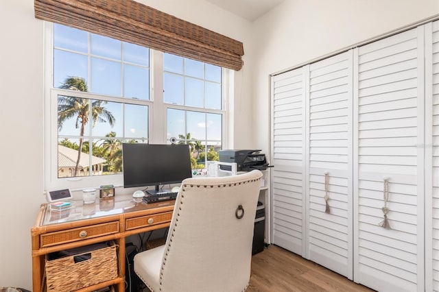 office area with light hardwood / wood-style floors