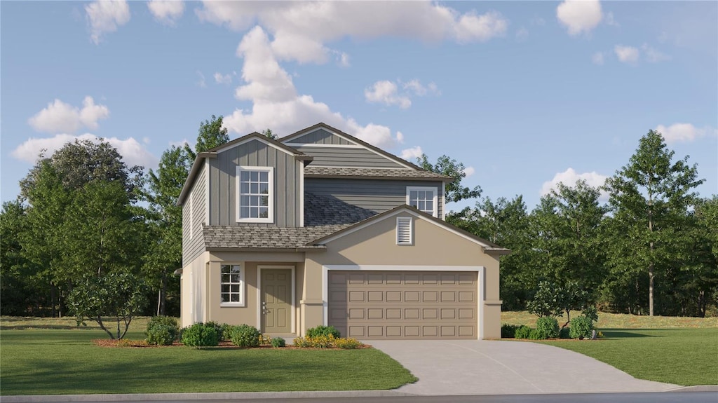 view of front of home featuring a garage and a front lawn