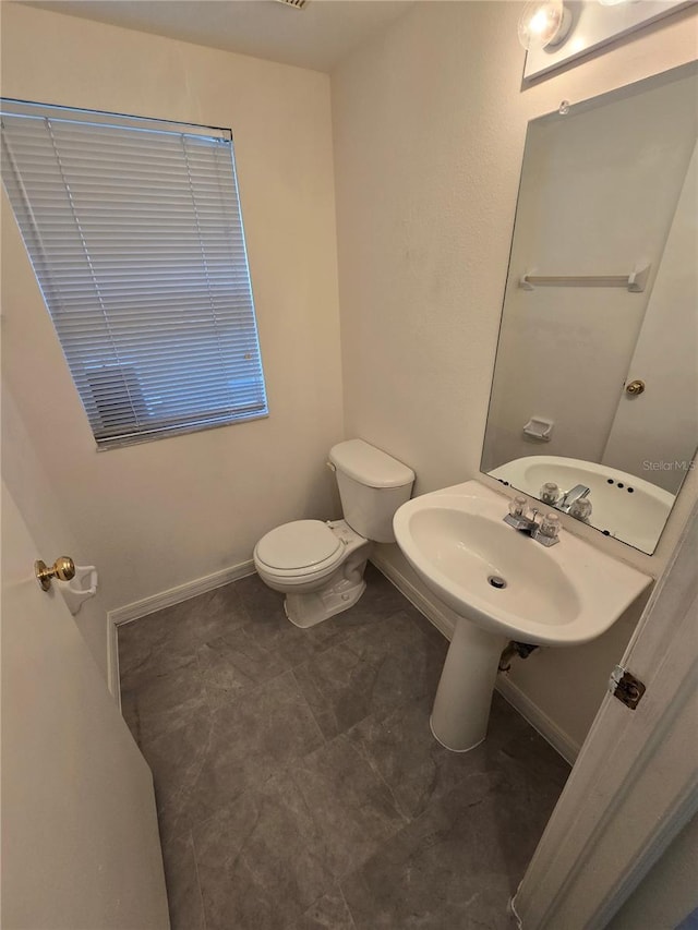 bathroom with sink and toilet