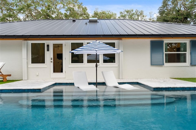 view of swimming pool featuring a patio area