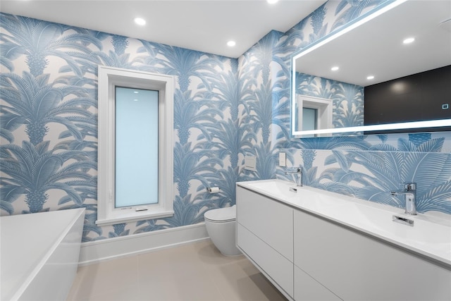 bathroom with vanity, tile patterned flooring, and toilet