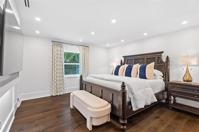 bedroom with dark wood-type flooring