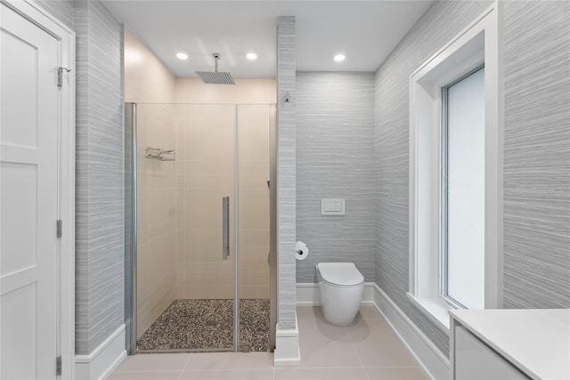 bathroom with vanity, tile patterned floors, toilet, and walk in shower